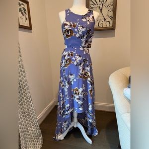 Abbeline floral Lilac dress with a high/low hem. Cute cut outs on the sides.